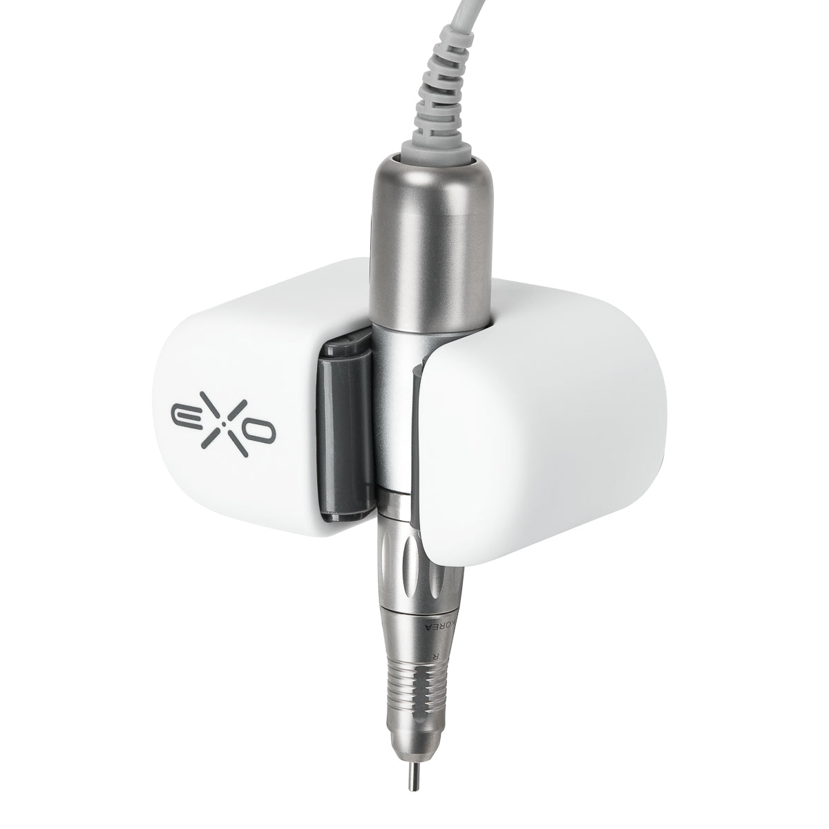 Exo universal adhesive holder for nail drill handpiece mounted on a desk