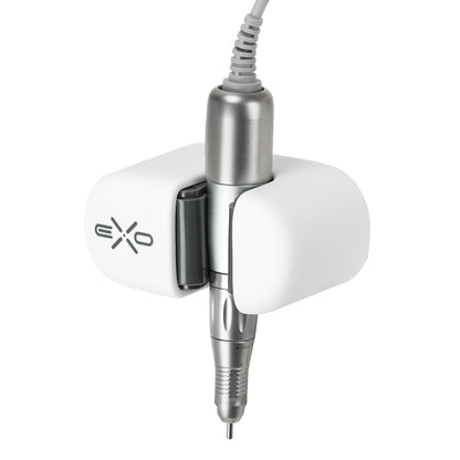 Exo universal adhesive holder for nail drill handpiece mounted on a desk