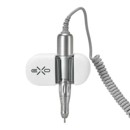 Exo universal adhesive holder for nail drill handpiece mounted on a desk