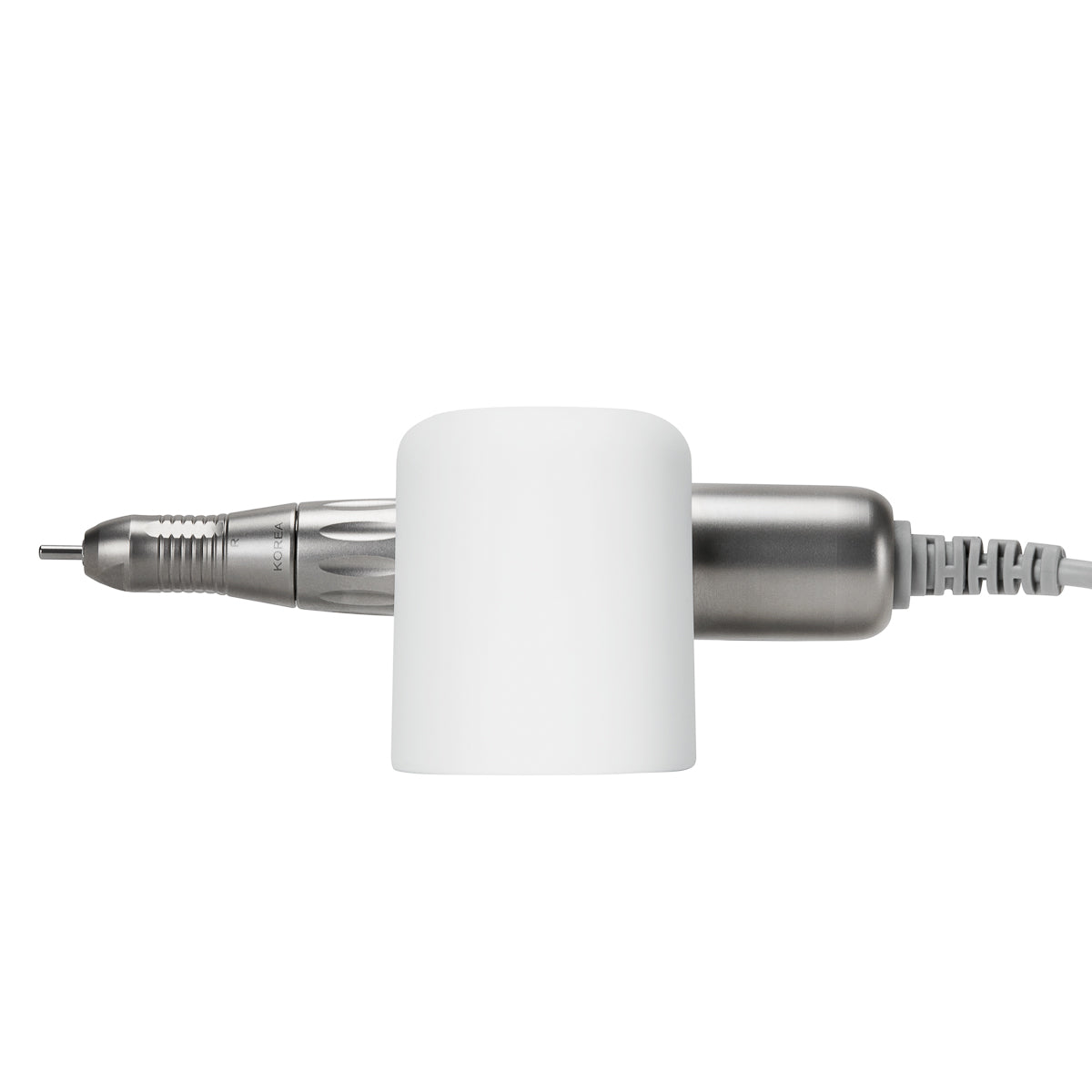 Exo universal adhesive holder for nail drill handpiece mounted on a desk