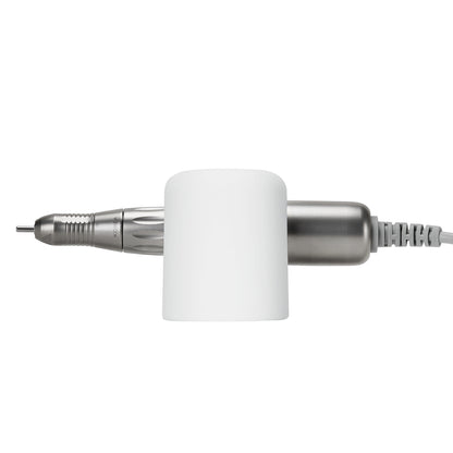 Exo universal adhesive holder for nail drill handpiece mounted on a desk