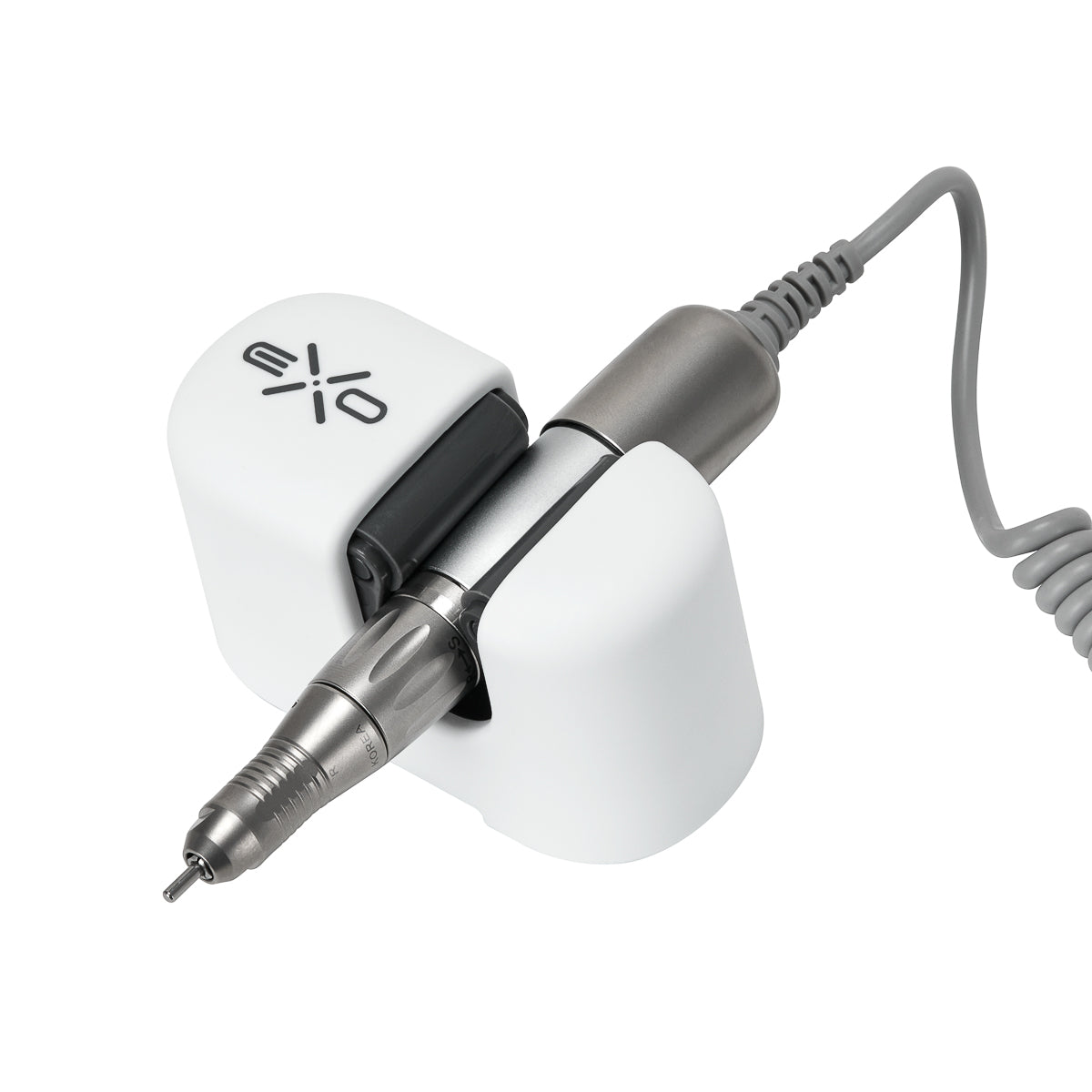 Exo universal adhesive holder for nail drill handpiece mounted on a desk