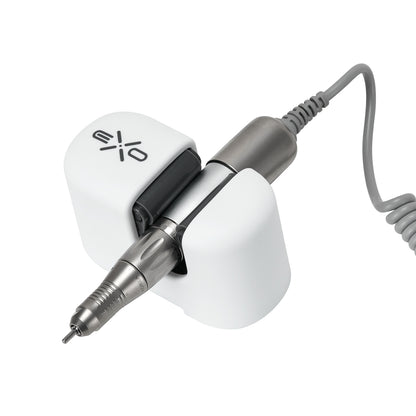 Exo universal adhesive holder for nail drill handpiece mounted on a desk