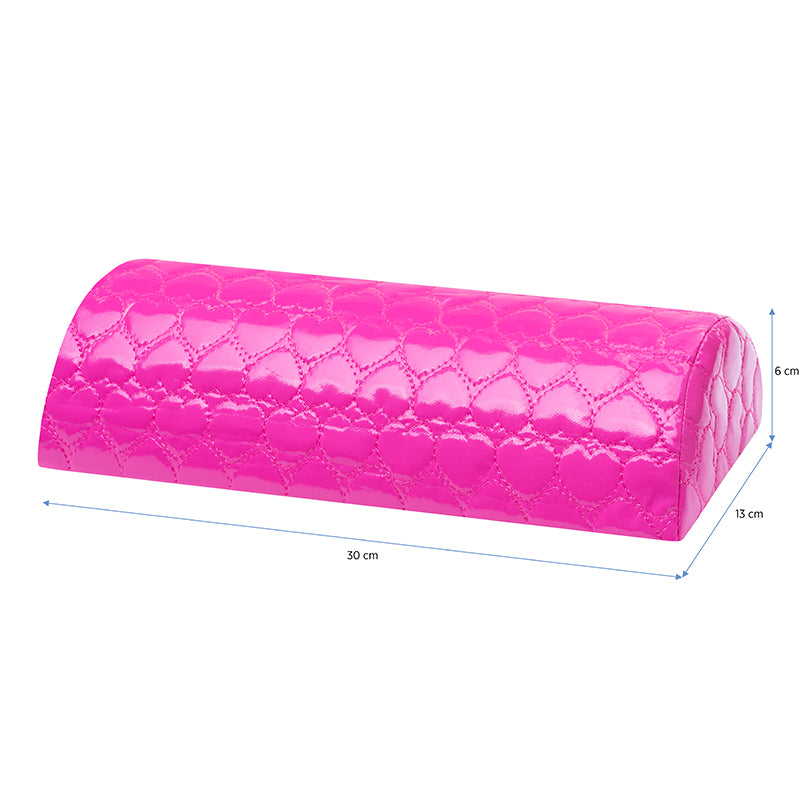 Patterned hand cushion in use during a manicure