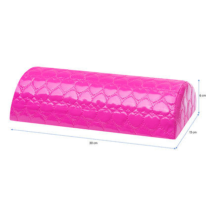 Patterned hand cushion in use during a manicure