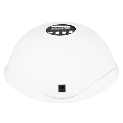 Seashel nail lamp in use during a manicure