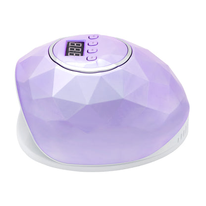 Shiny nail lamp in use during a manicure