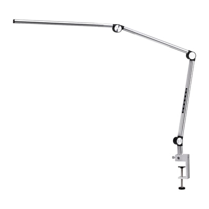 Yoga lamp clamped to a treatment table